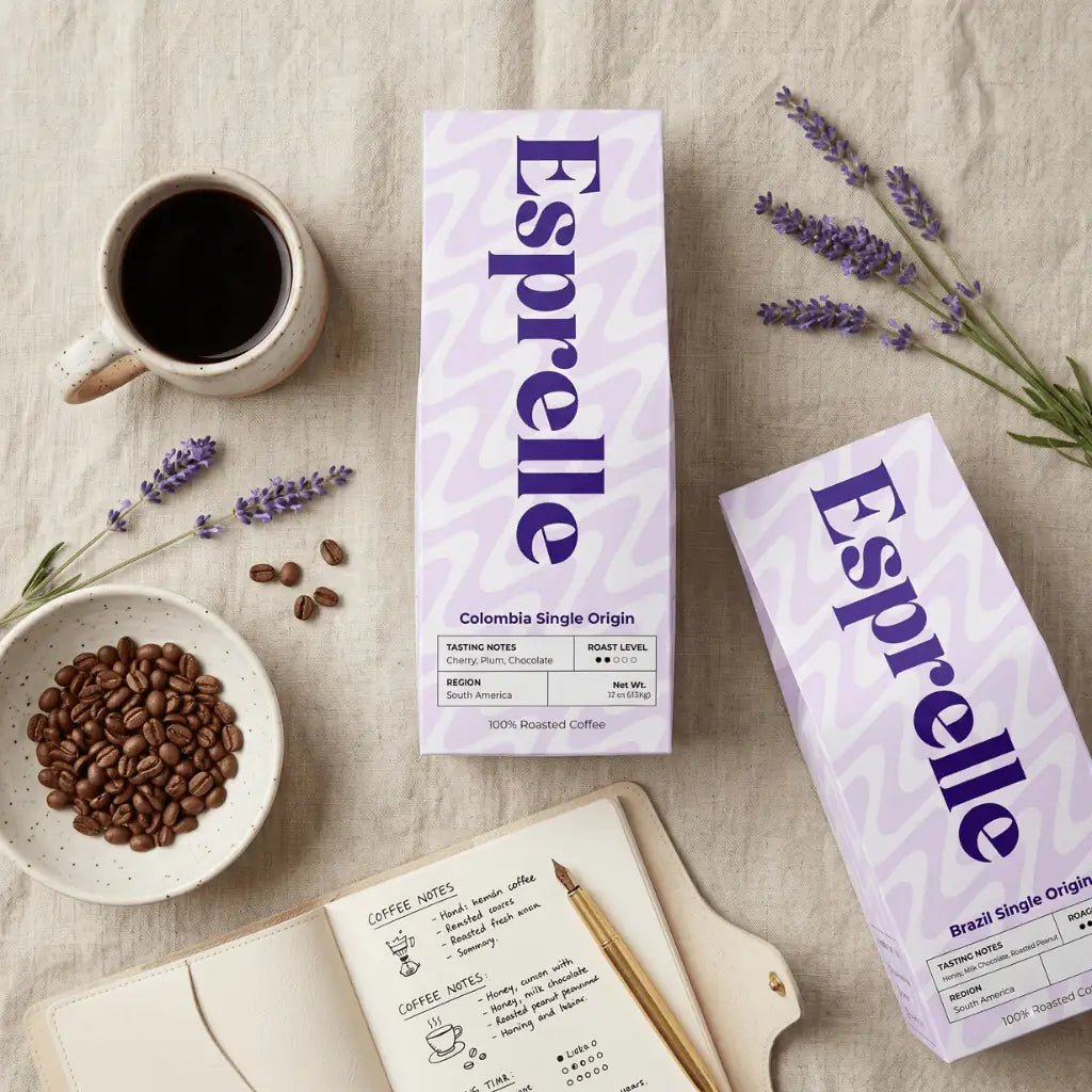 Esprelle coffee boxes with coffee beans, a cup of coffee, and lavender on a textured surface.
