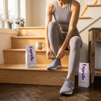 Person tying their shoes on a staircase with Esprelle coffee bags nearby