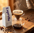 Esprelle coffee bag with a pour-over coffee setup on a wooden surface.